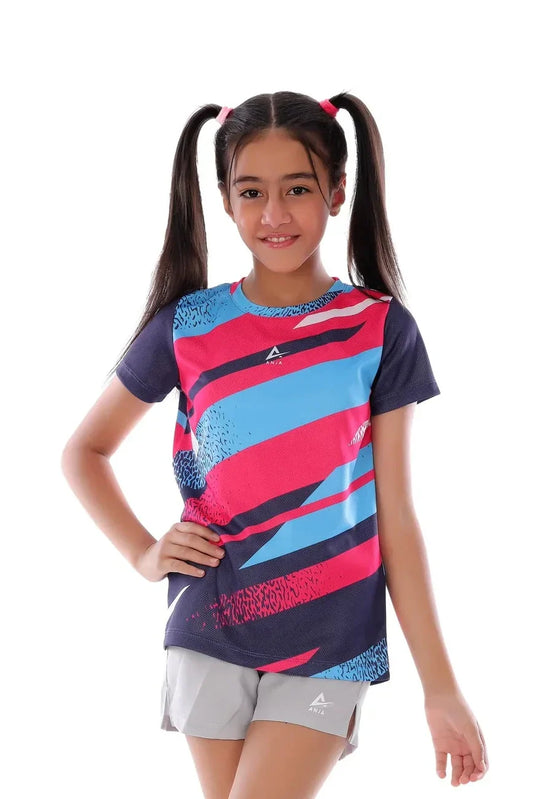 Young girl wearing a colorful sports outfit with a brand logo on a white background