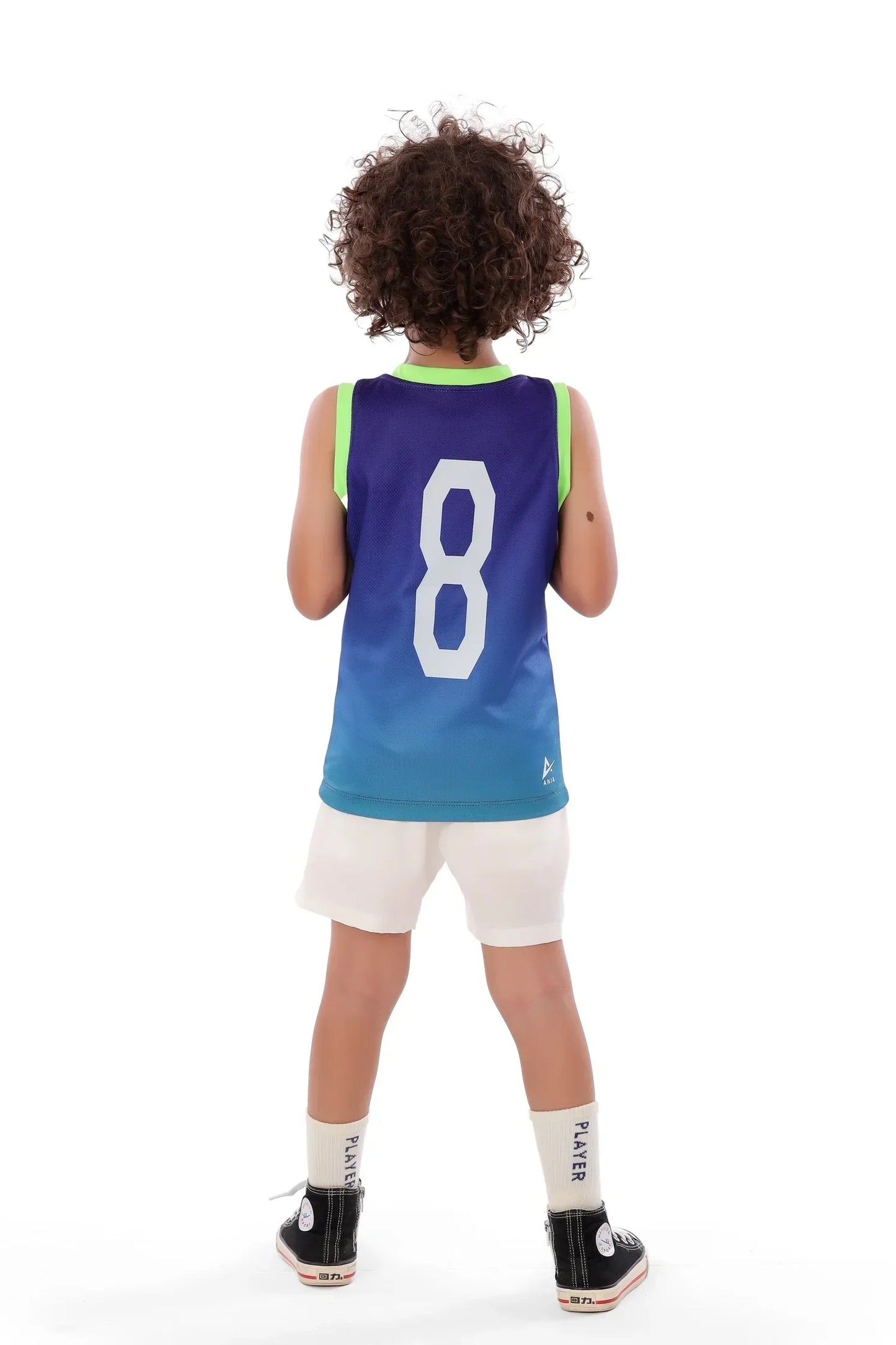 Child wearing a blue basketball jersey with the number 8 on a white background