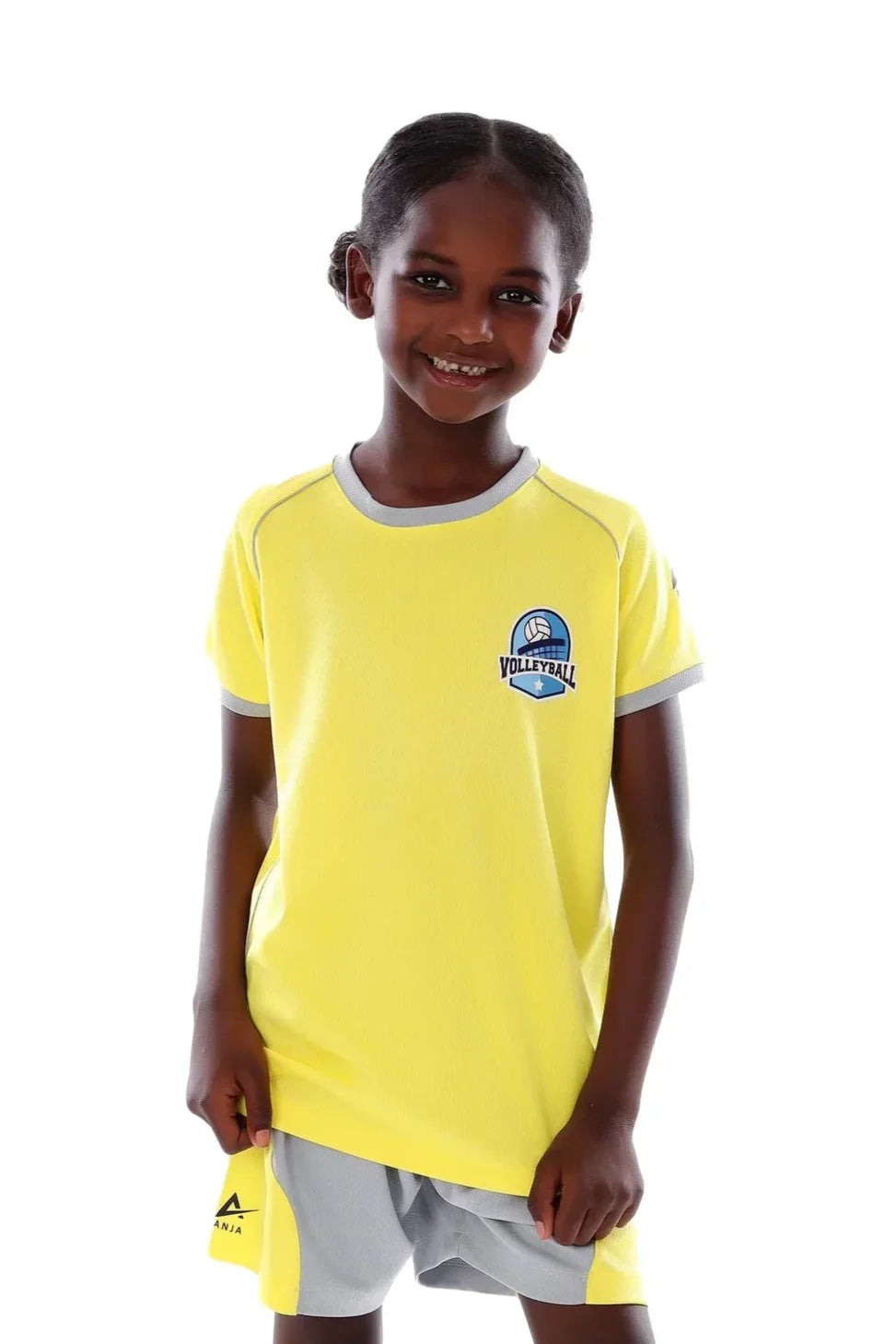 Child wearing a yellow sports jersey with a logo on a white background