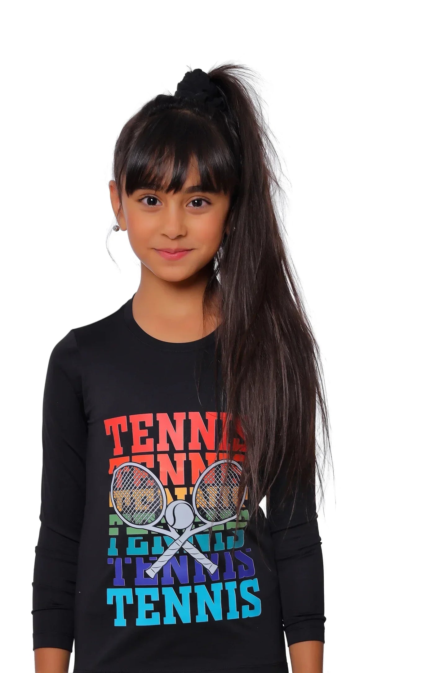 Young girl wearing a black long-sleeve shirt with colorful 'Tennis' text and graphics.