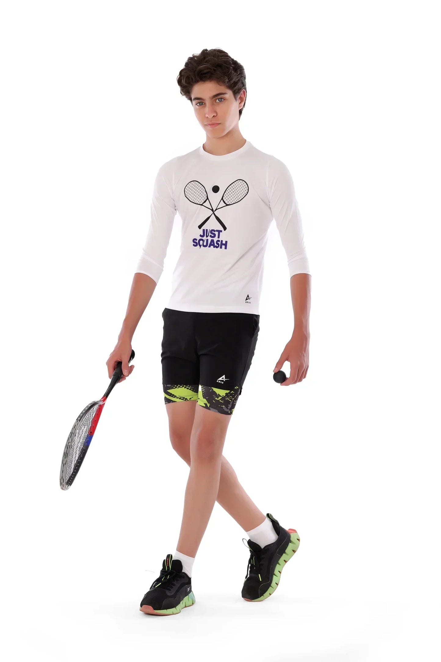 Person wearing a 'Just Squash' shirt and shorts with a racket on a white background