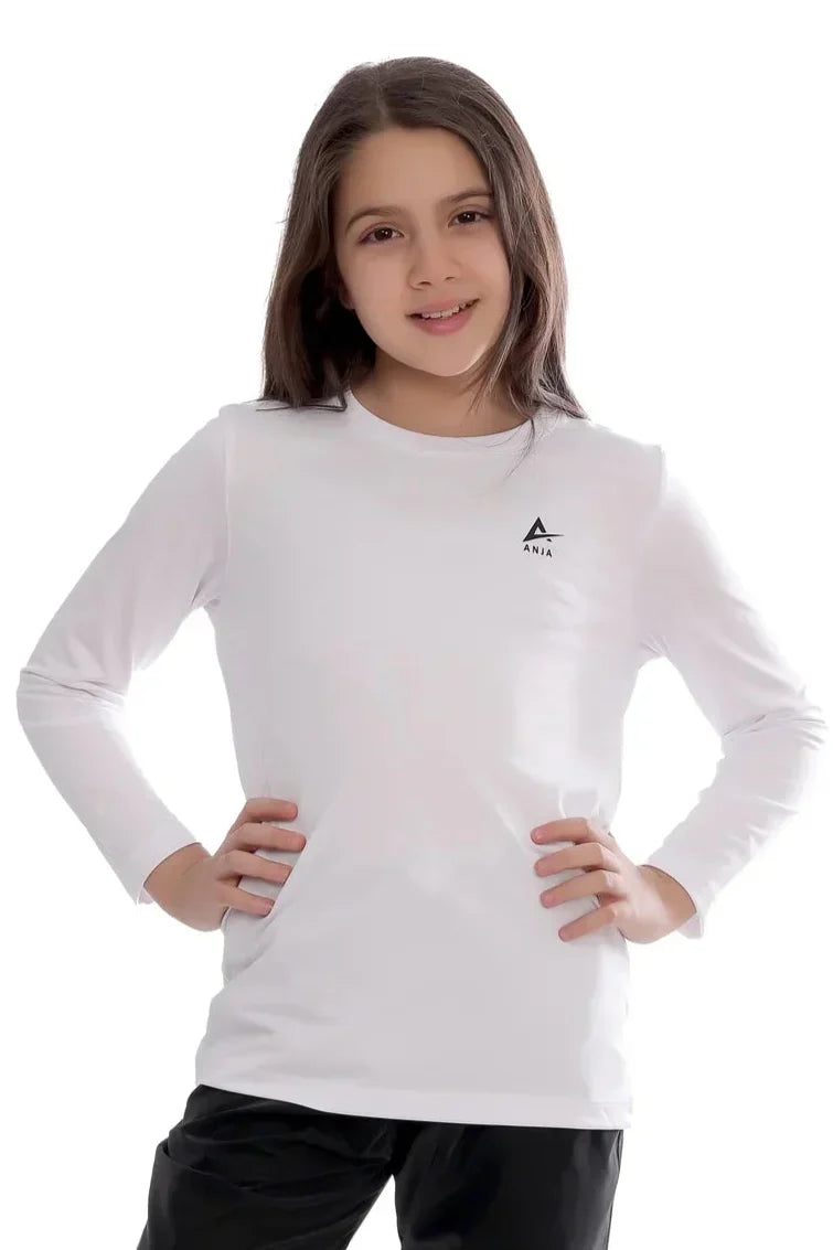 Young girl wearing a white long-sleeve shirt with a logo on a white background