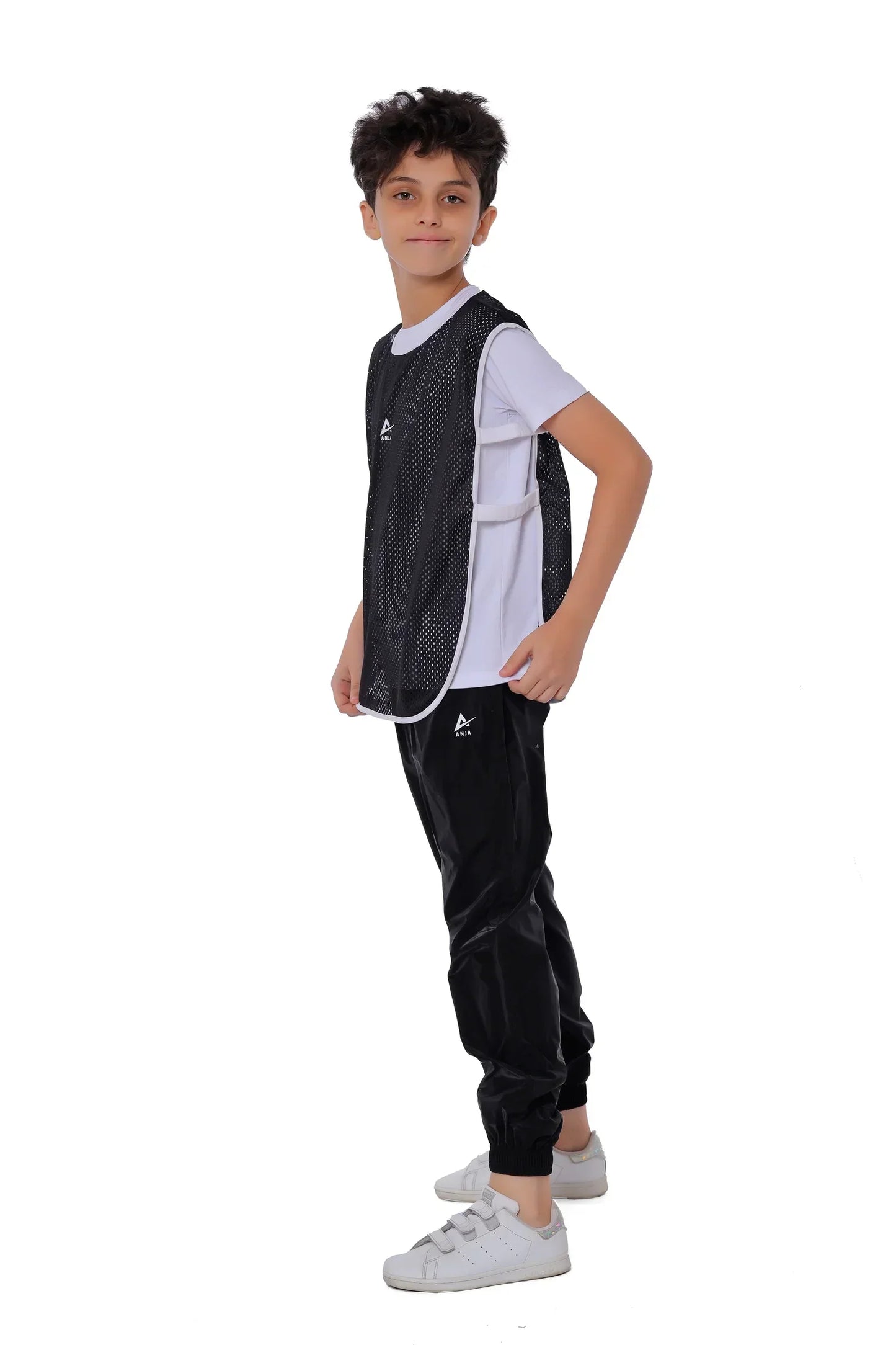 Person wearing a black and white tracksuit on a white background