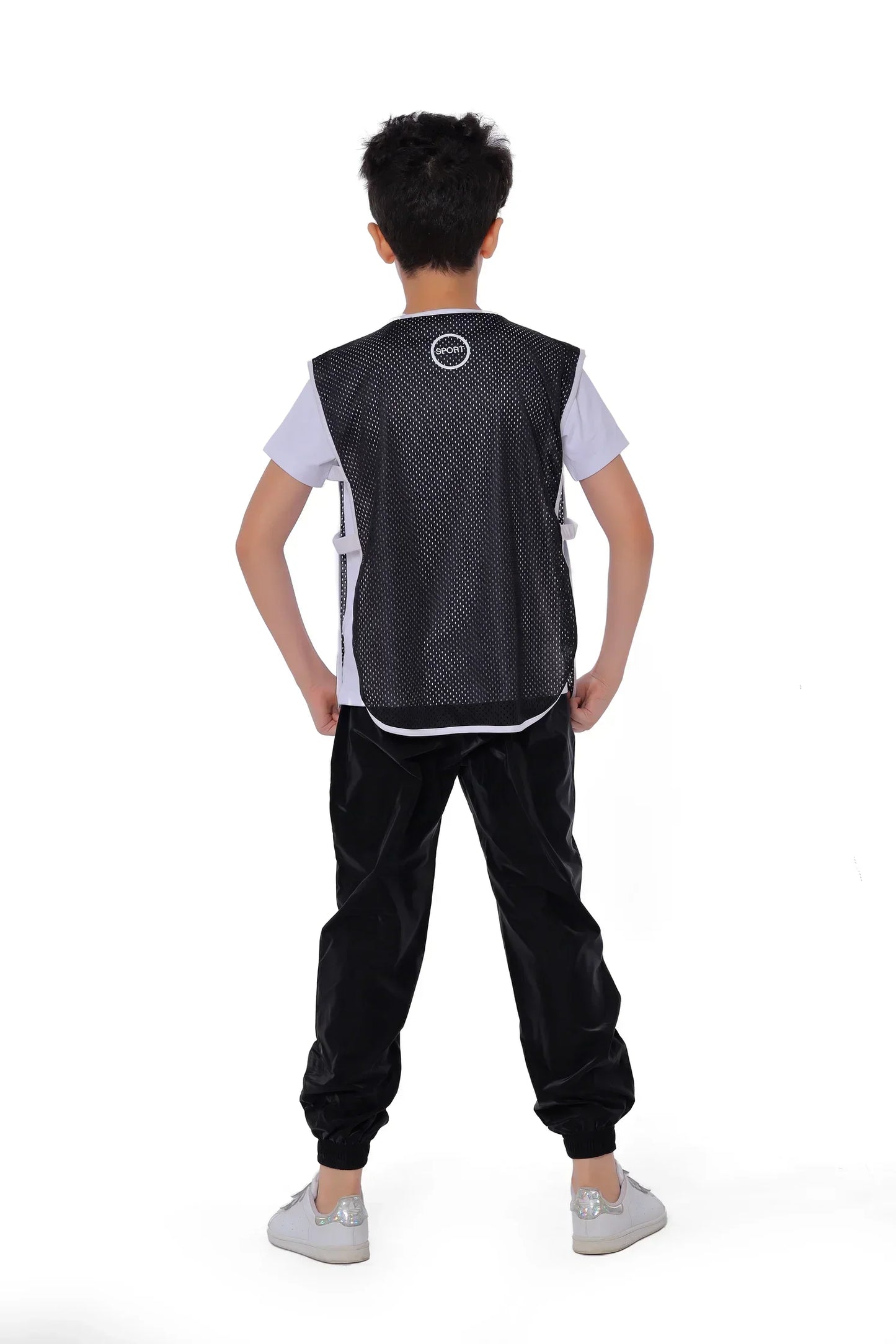 Person wearing a black and white sports outfit on a white background