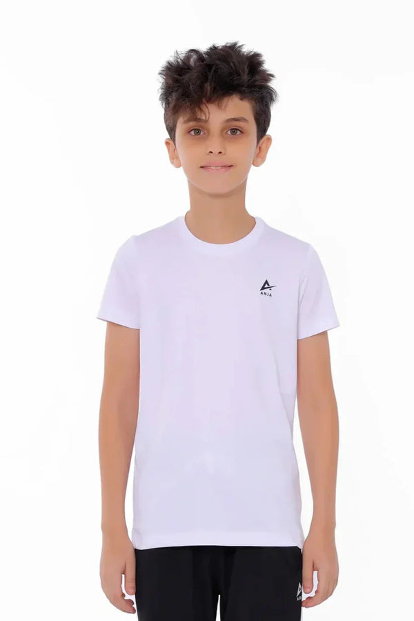 Child wearing a white t-shirt with a small logo on a white background