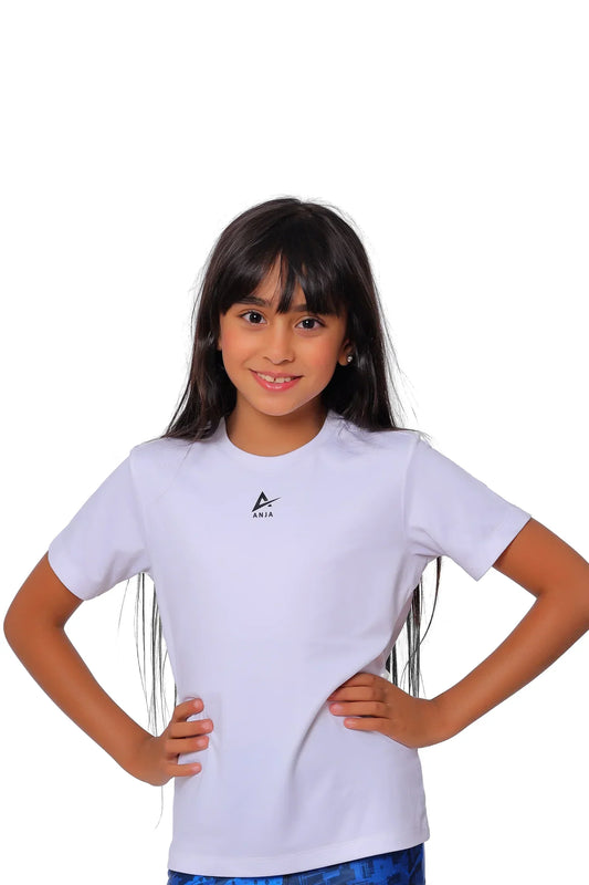 Young girl wearing a white t-shirt with a logo on a white background