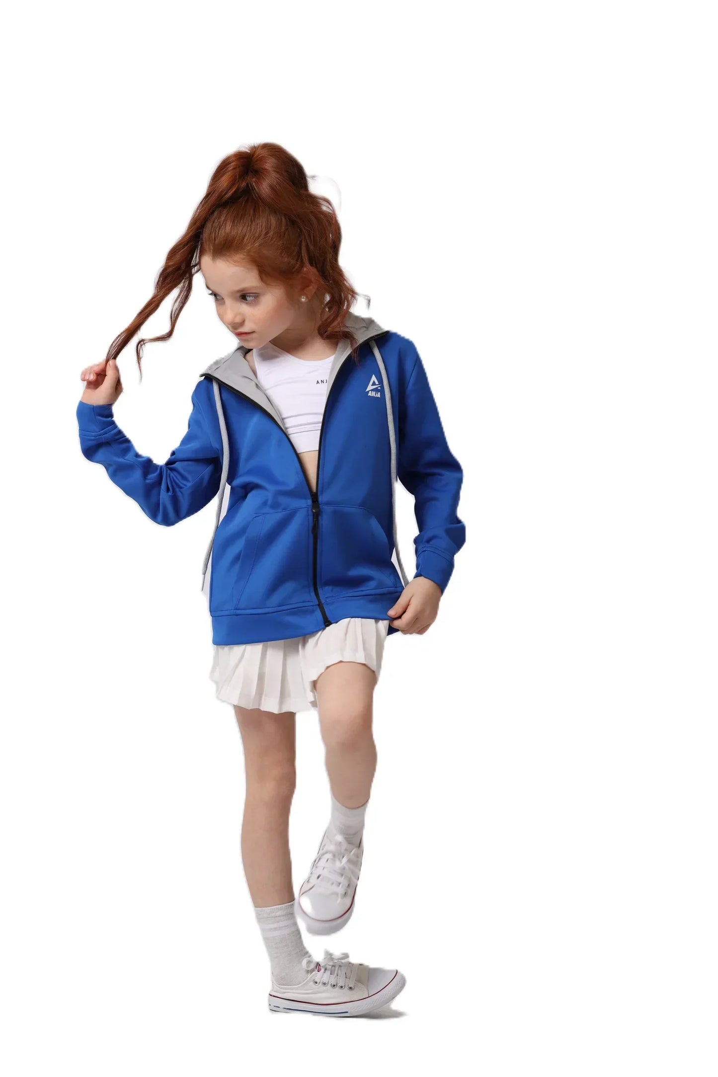 Child wearing a blue tracksuit with a visible brand logo on a white background