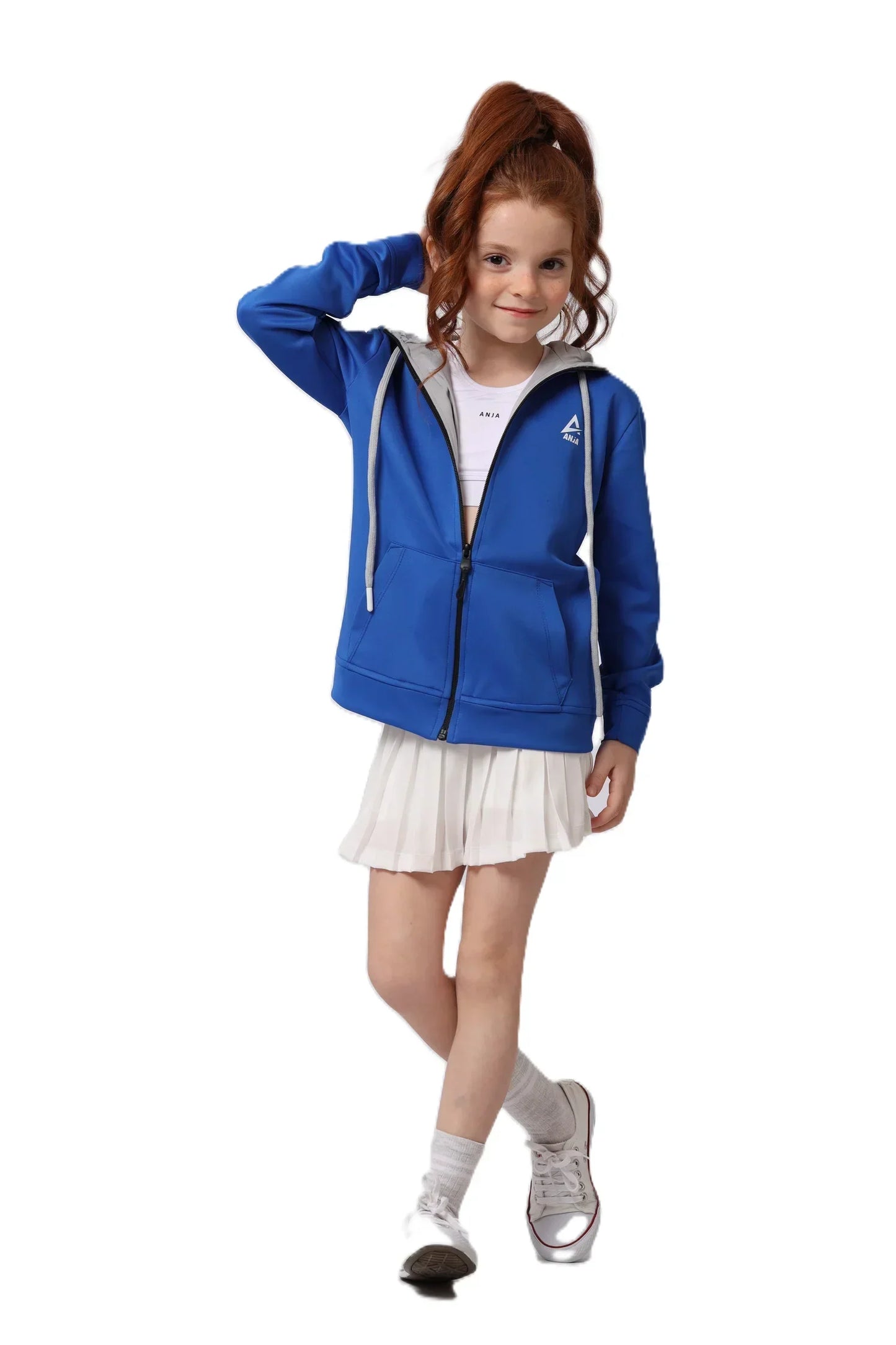 Young girl wearing a blue hoodie and white skirt on a white background