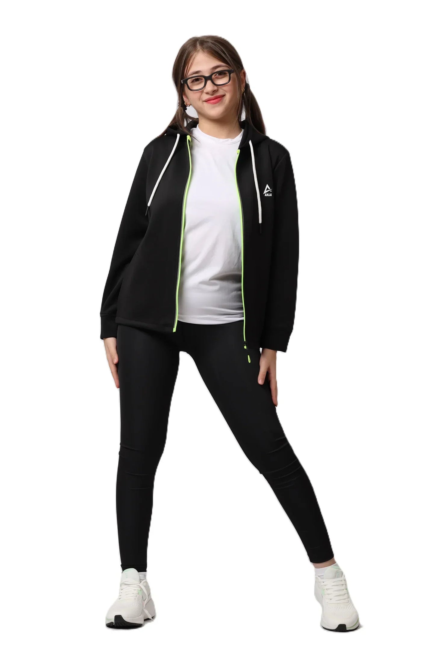 Person wearing a black tracksuit with a white shirt underneath on a white background