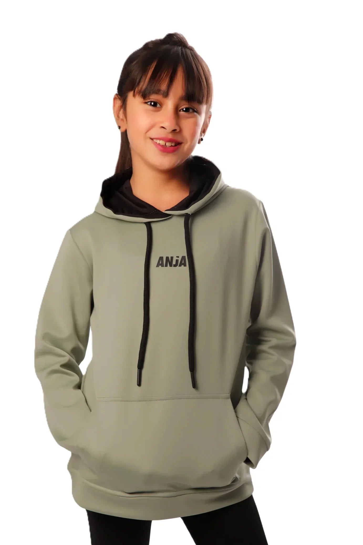 Person wearing a green hoodie with 'ANJA' branding on a white background