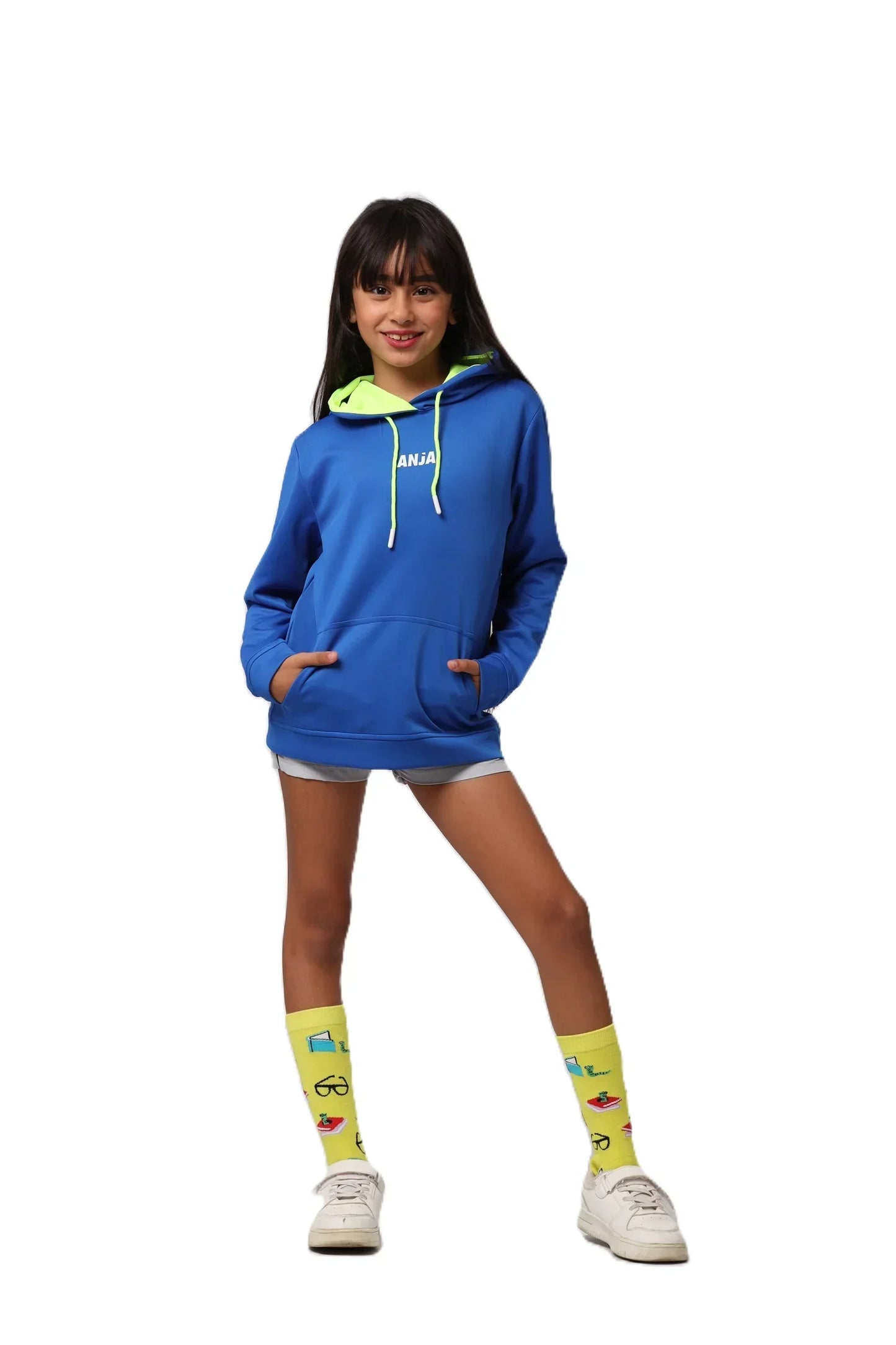 Person wearing a blue hoodie with a logo, white shorts, and yellow socks on a white background
