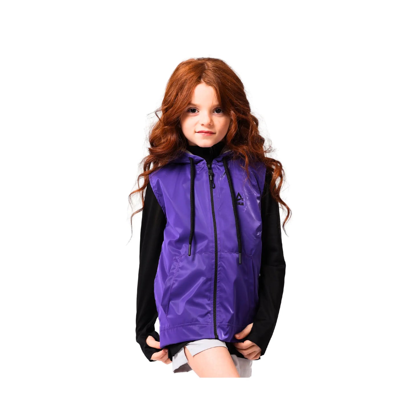 Child wearing a purple vest over a black hoodie on a white background