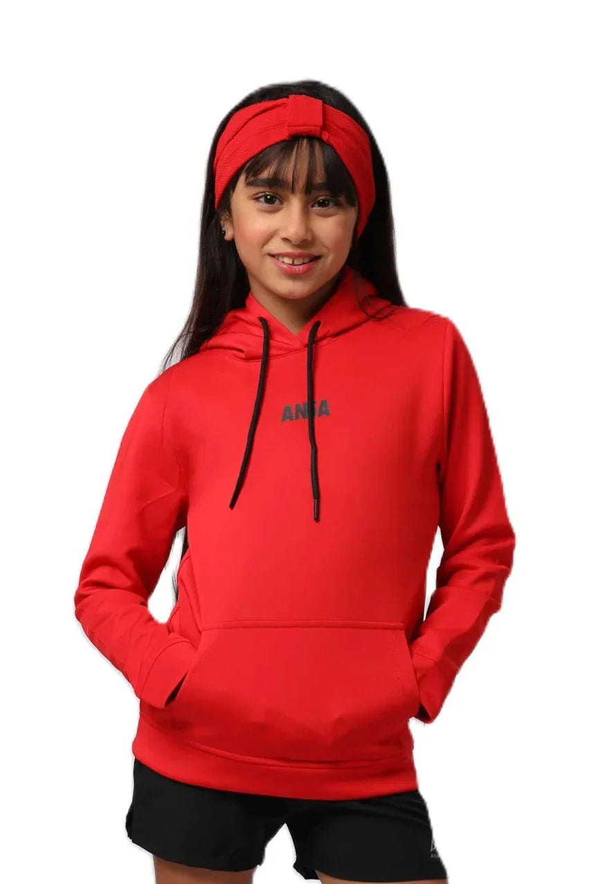 Person wearing a red hoodie with a brand logo on a white background