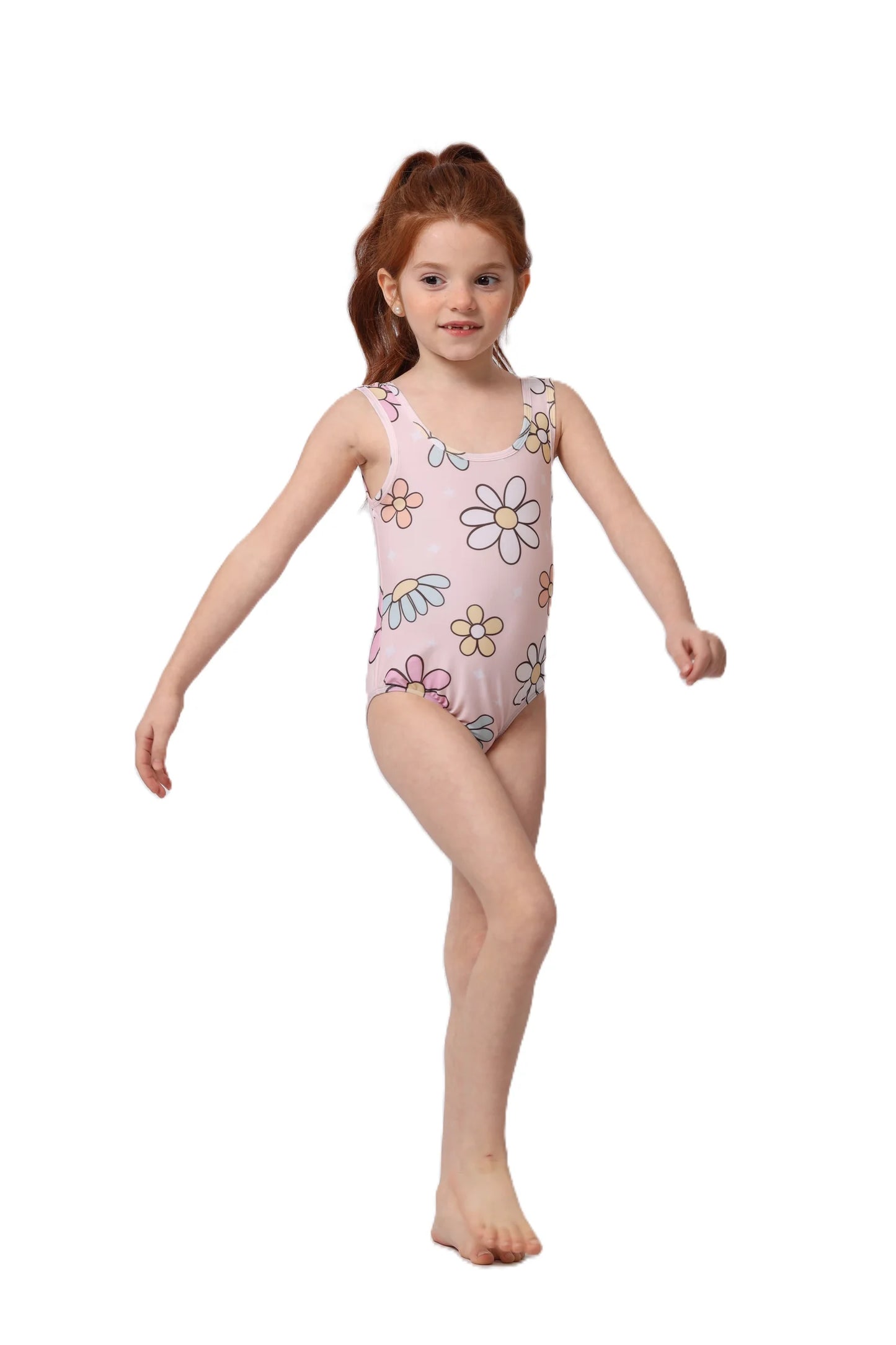 Young girl wearing a pink swimsuit with floral patterns on a white background
