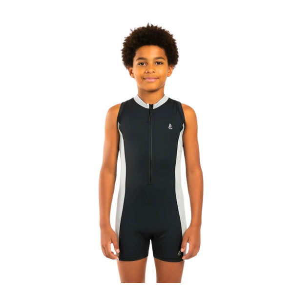 Child wearing a black and white swimsuit on a white background