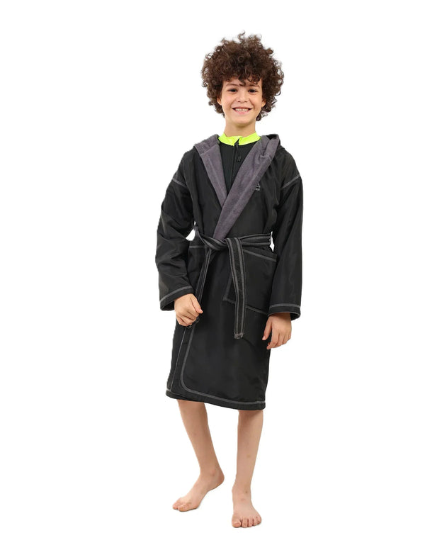 Child wearing a black and gray robe on a white background