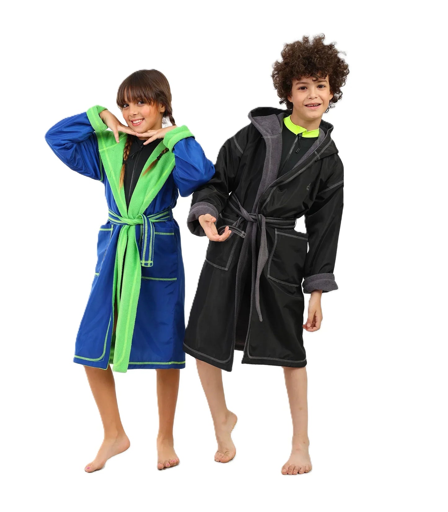 Two children wearing colorful robes on a white background