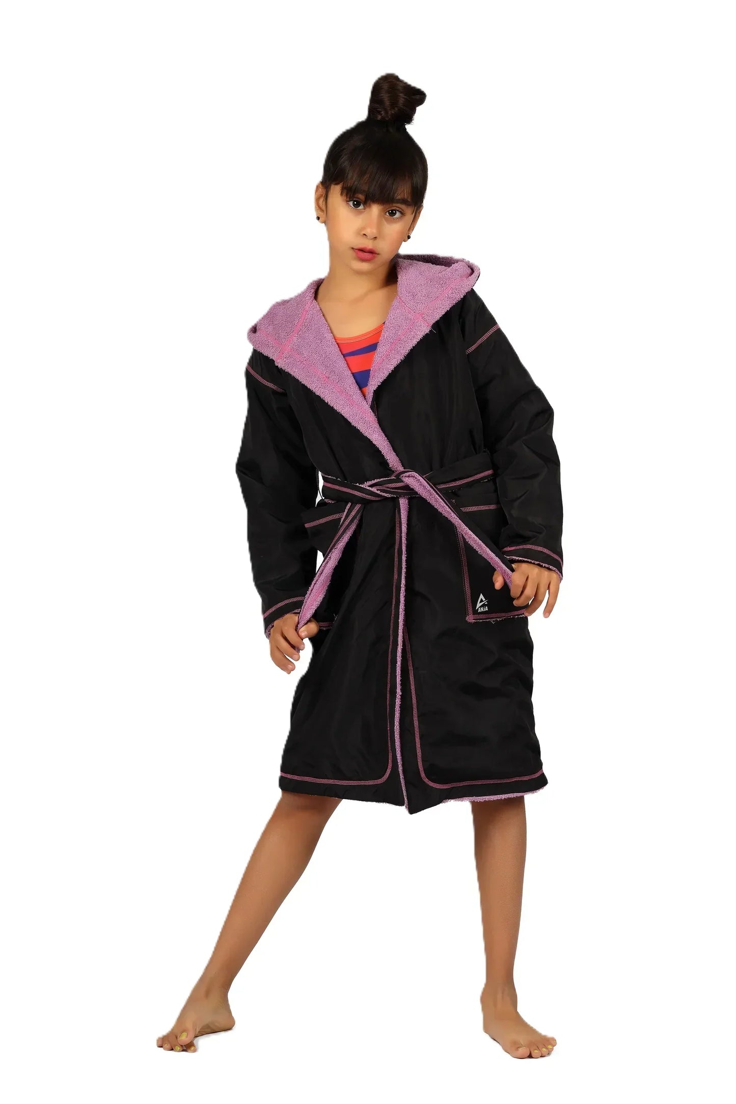 Black bathrobe with pink trim worn by a model on a white background