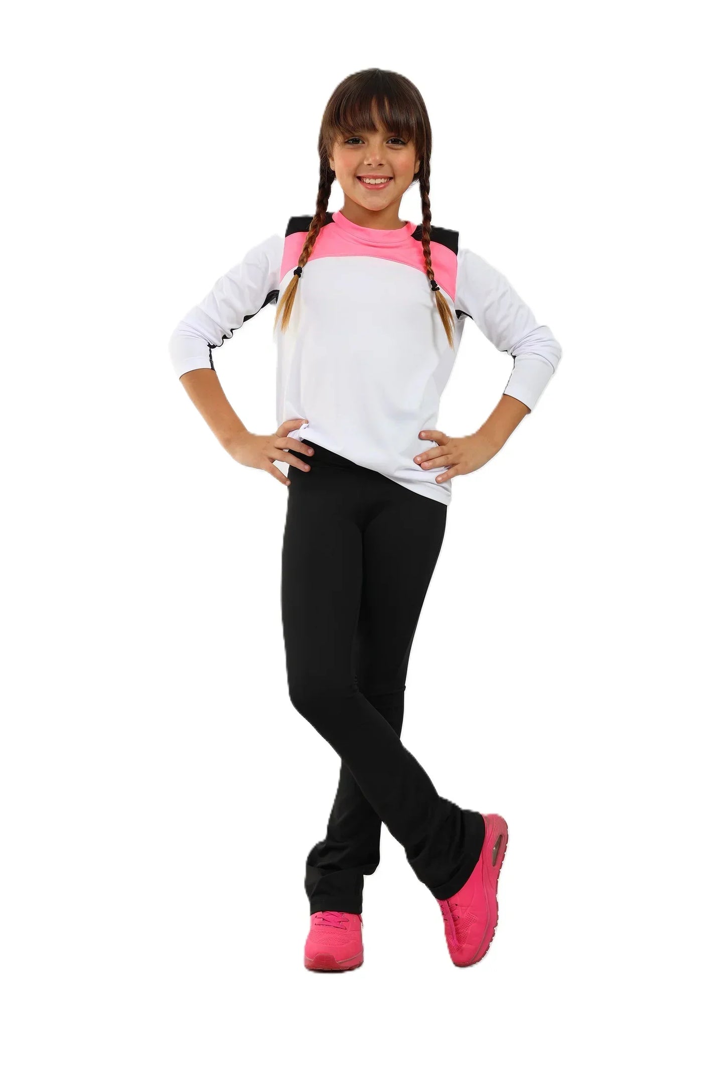 Young girl wearing a white long-sleeve shirt with pink accents, black leggings, and pink shoes on a white background