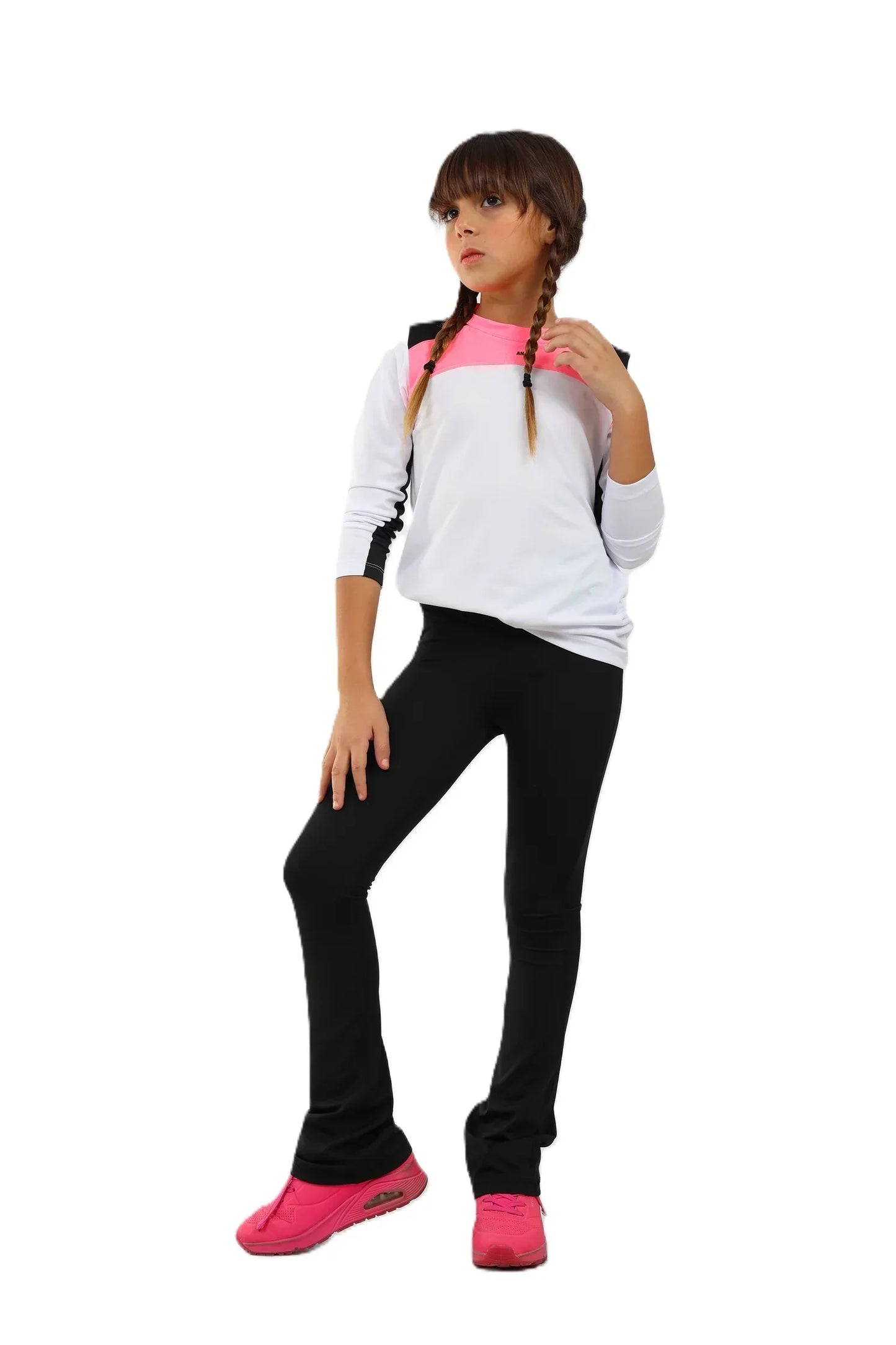 Child wearing a white and pink top with black pants on a white background