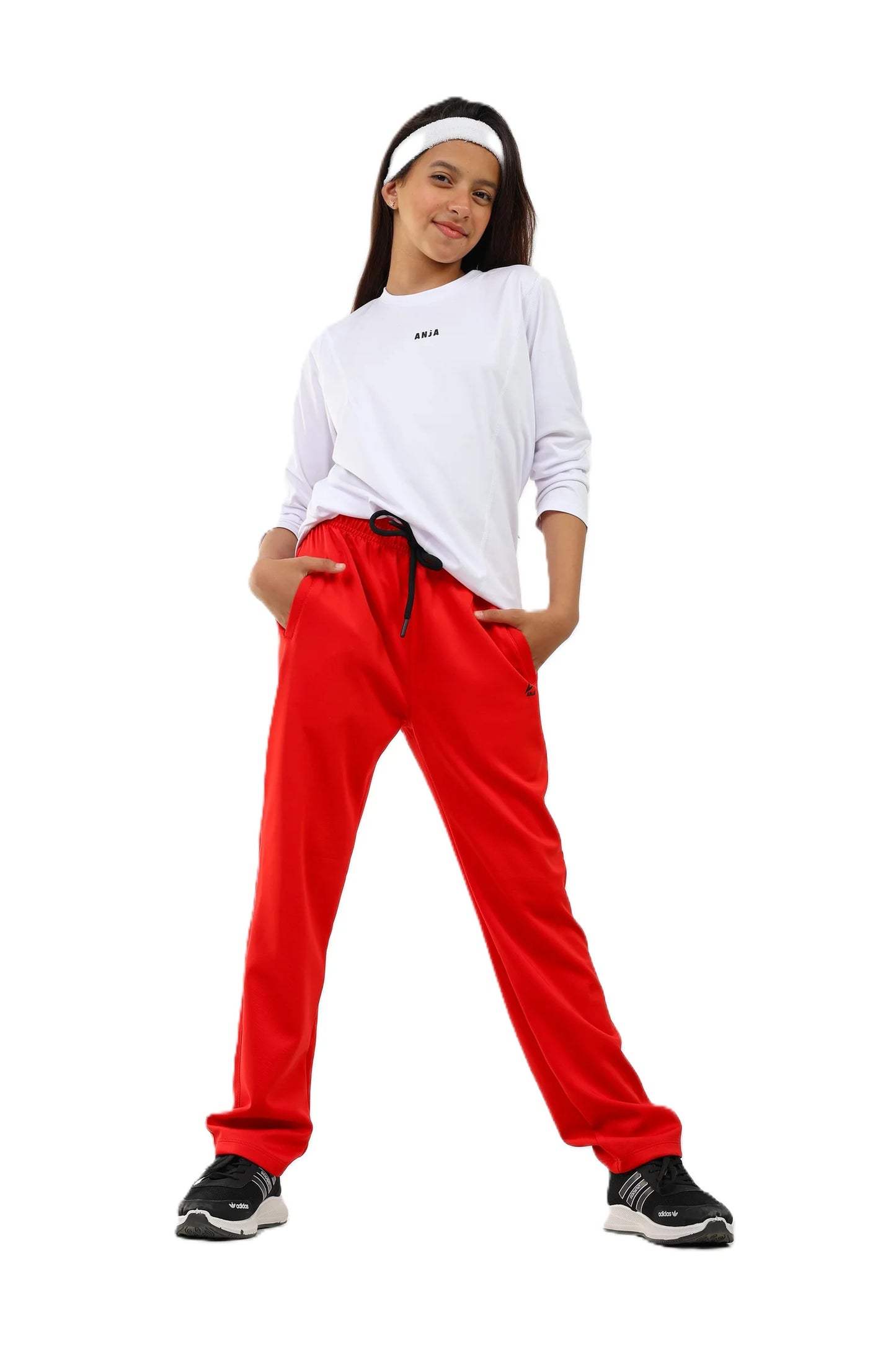Person wearing a white sweatshirt and red pants on a white background