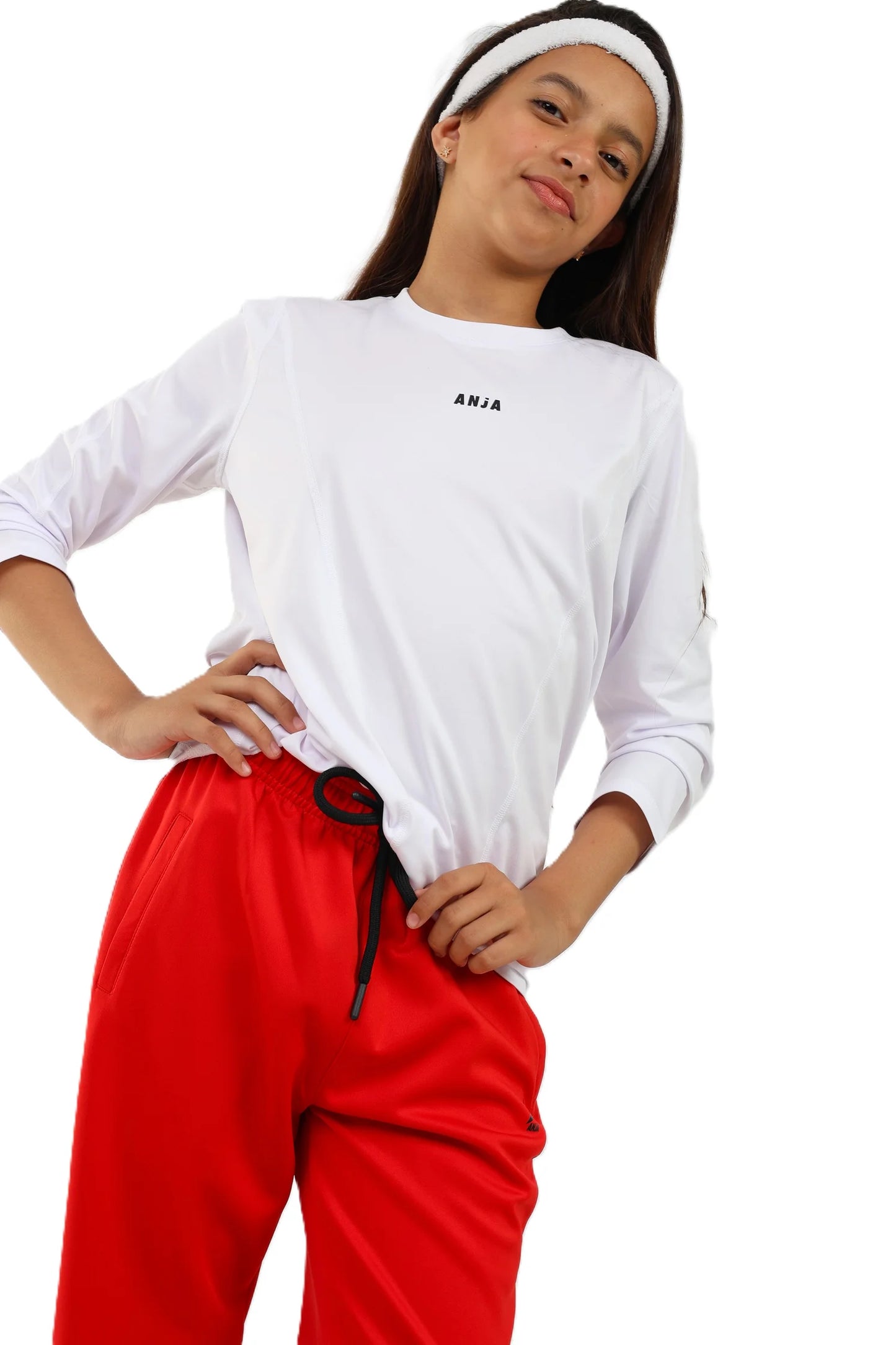 Person wearing a white long-sleeve shirt and red pants on a white background