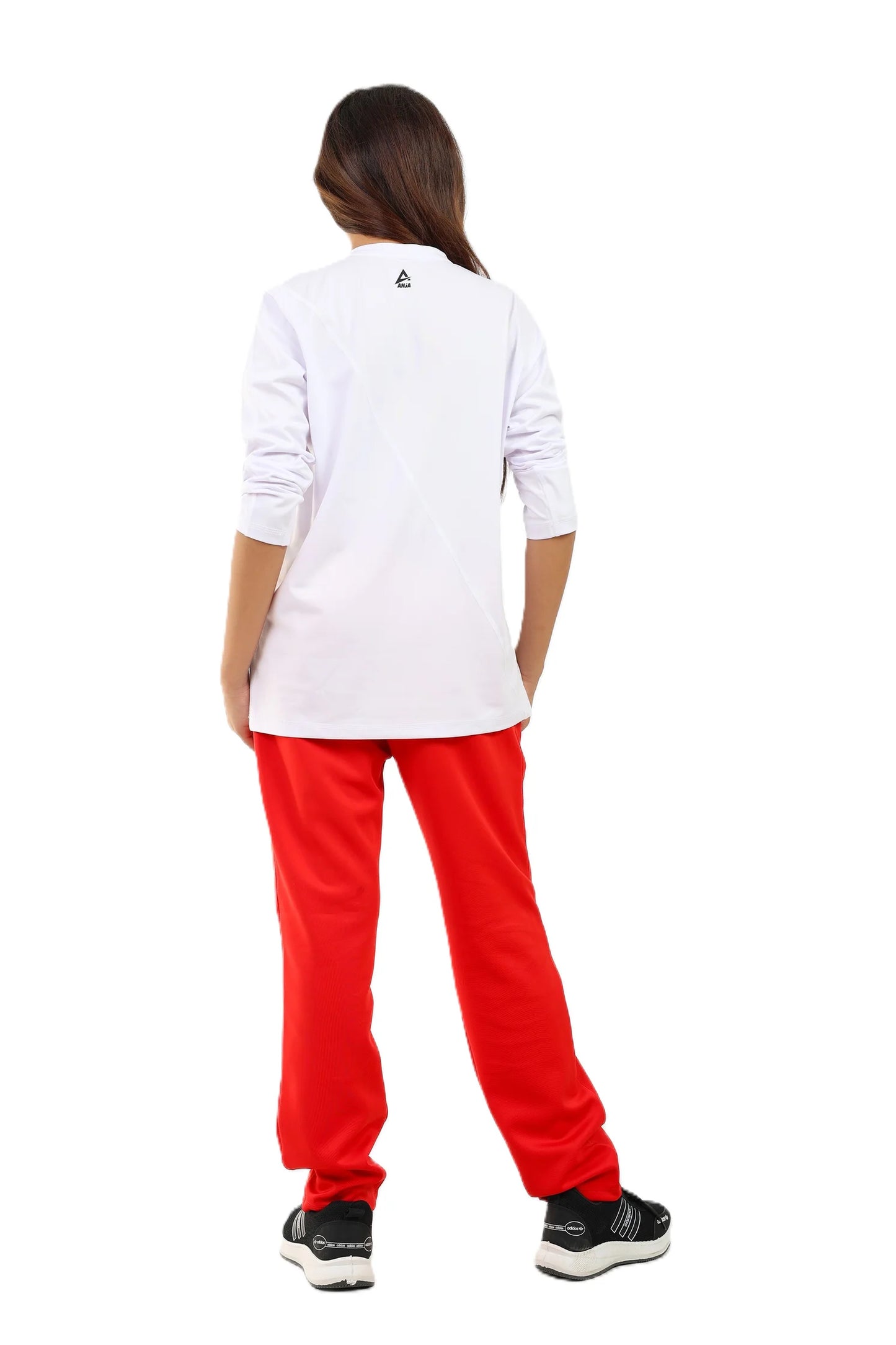 Person wearing a white shirt and red pants on a white background
