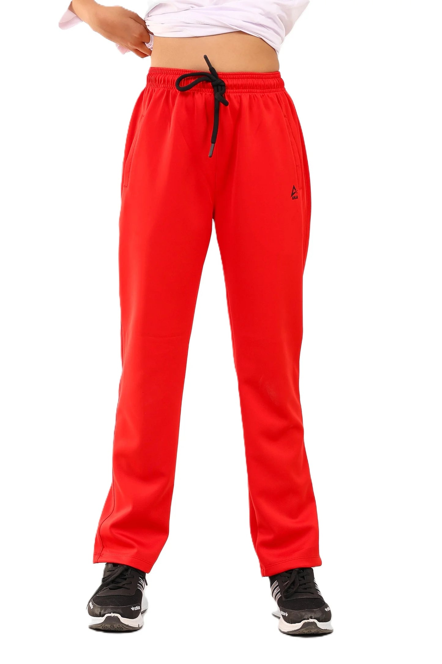Red sweatpants with a small logo on a white background