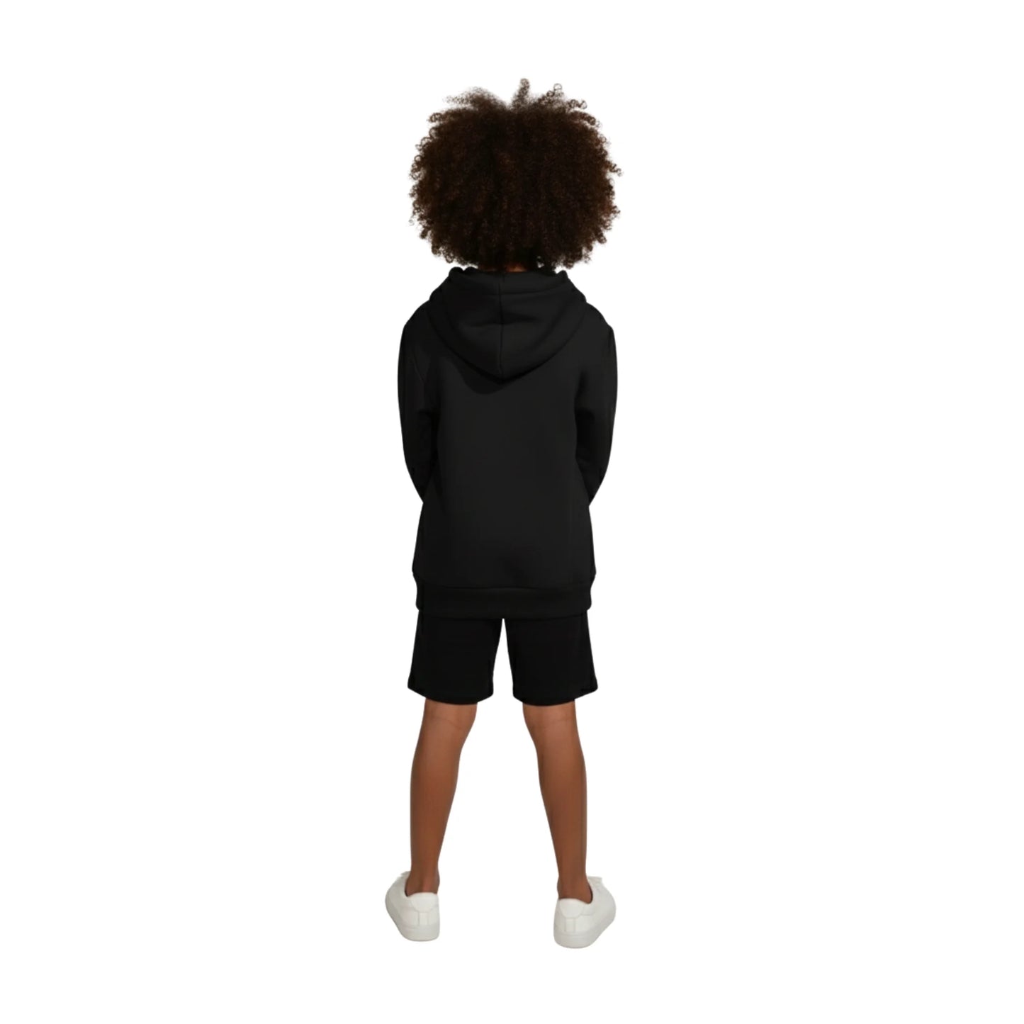 Child wearing a black hoodie and shorts set on a white background
