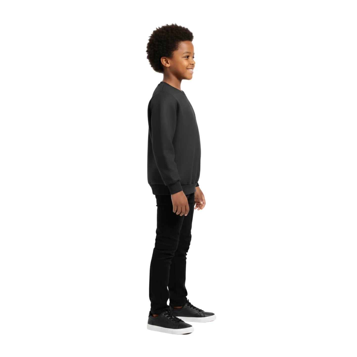 Child wearing a black sweatshirt and pants on a white background