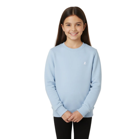 Young girl wearing a light blue sweatshirt on a white background