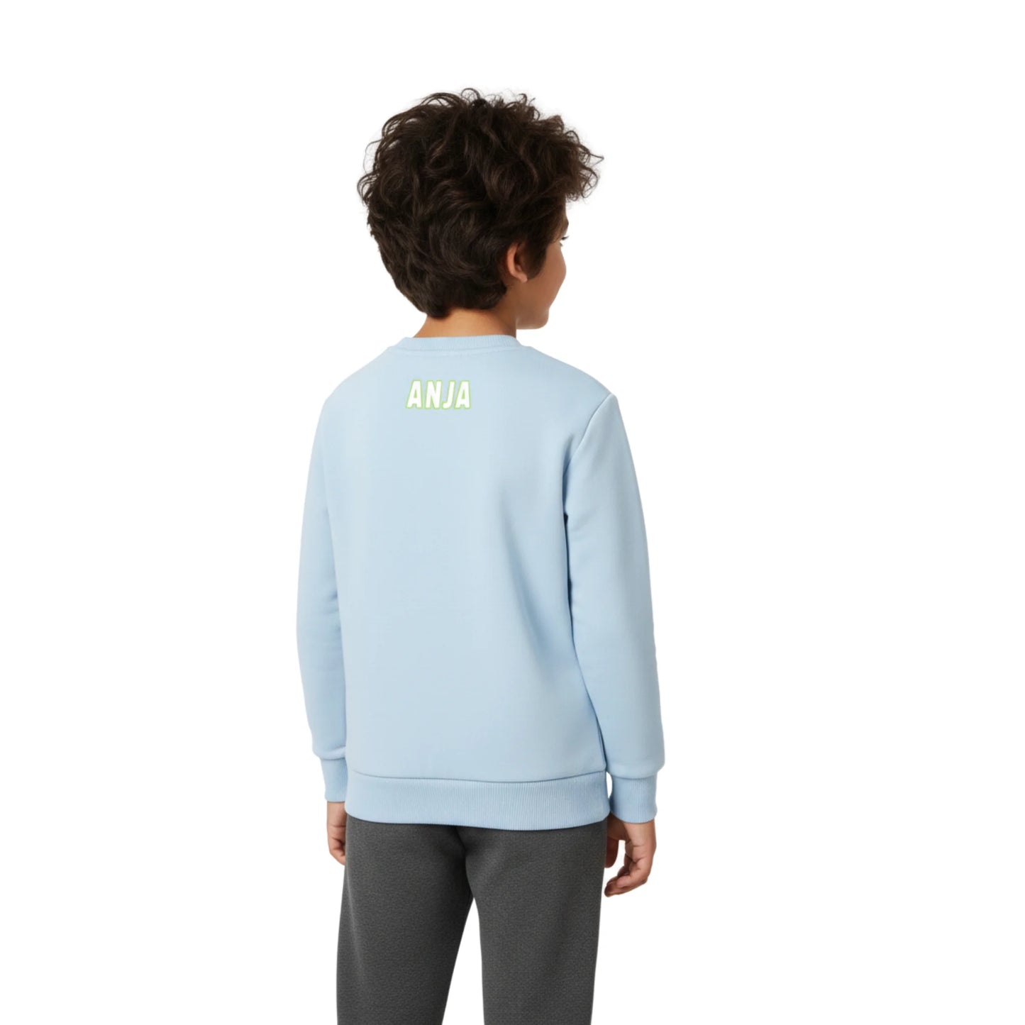Child wearing a light blue sweatshirt with 'ANJA' printed on the back, standing against a white background.